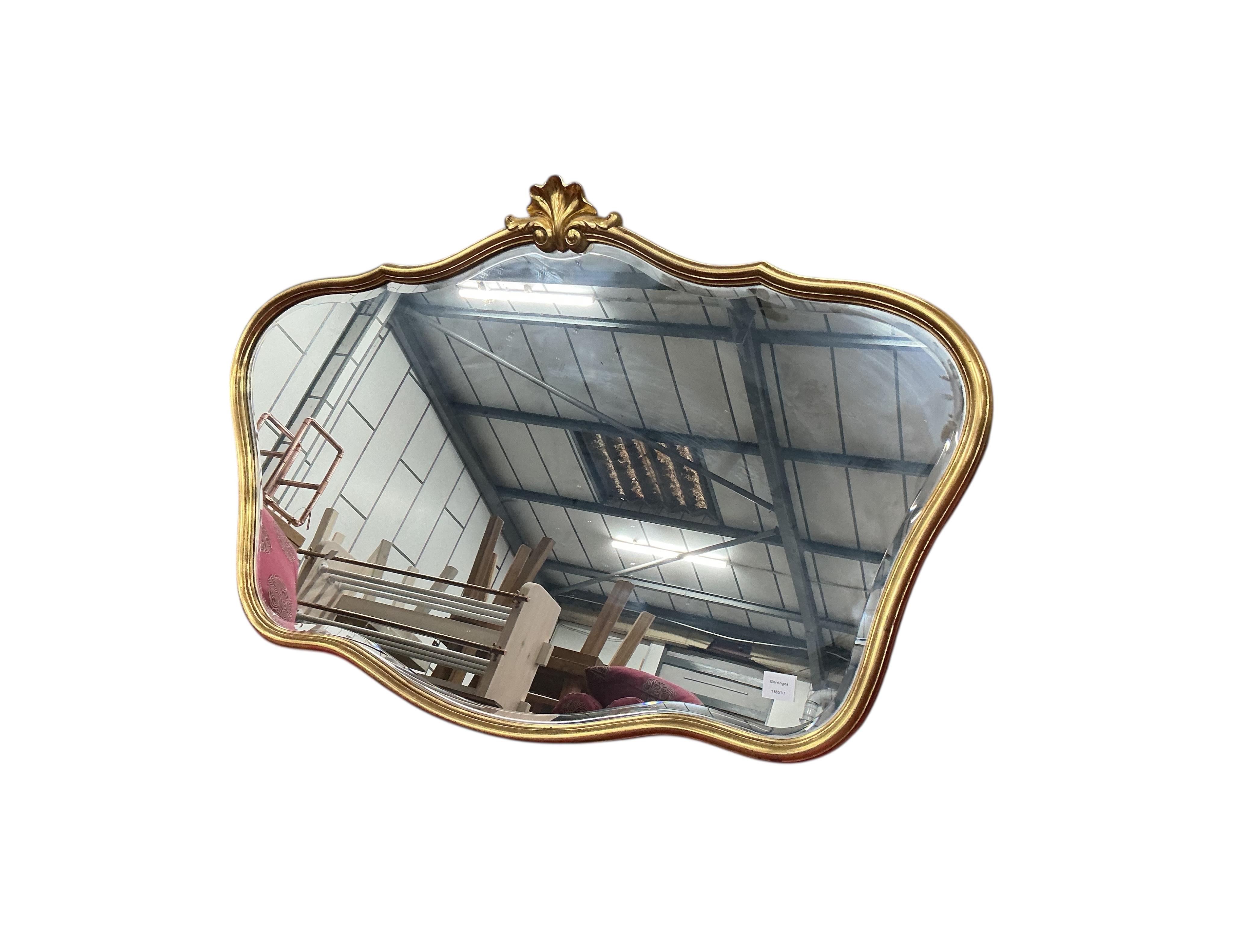 A reproduction Victorian style gilt composition wall mirror, width 120cm, height 80cm